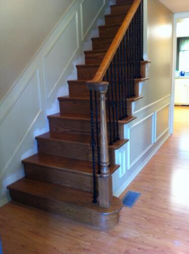 Staircase Remodel From Carpet To Hardwood with Rod Iron Ballasters